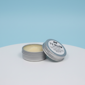 T's Tallow beef tallow lip balm in a metal container open