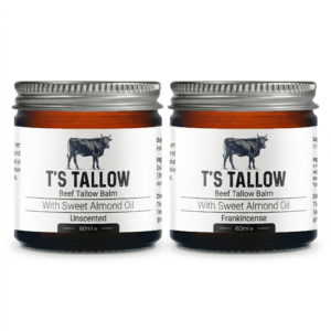 Two jars of beef tallow balm side by side, labeled with a cow illustration and ingredients visible on the label (Beef Tallow Balm with Sweet Almond Oil).