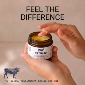 Hands scooping yellow balm from a brown jar labeled 'T's Tallow' with the slogan 'FEEL THE DIFFERENCE' above.